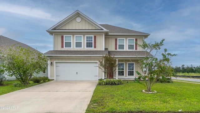 view of front of home featuring a garage and a front yard