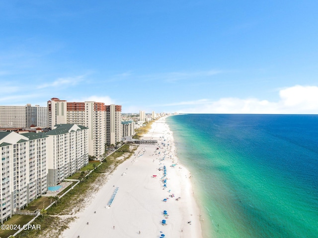 bird's eye view featuring a view of the beach and a water view