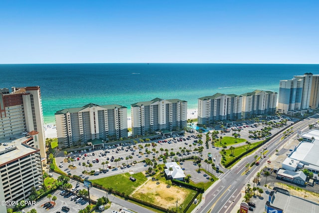 birds eye view of property featuring a water view and a view of the beach