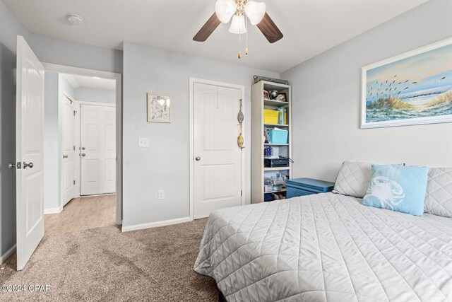 carpeted bedroom featuring ceiling fan