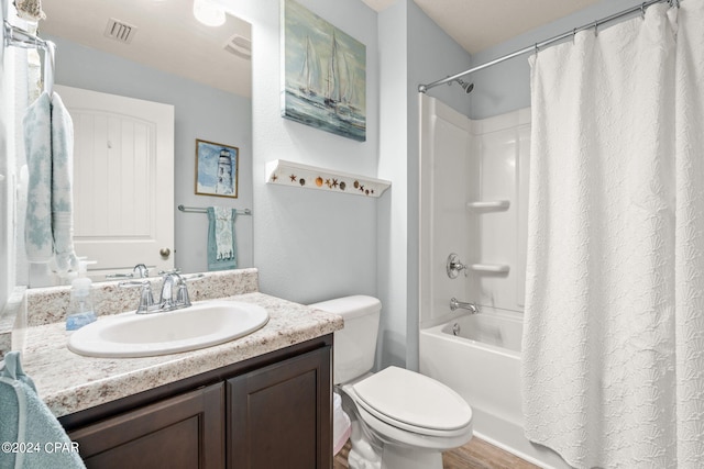 full bathroom featuring shower / bath combination with curtain, hardwood / wood-style floors, vanity, and toilet