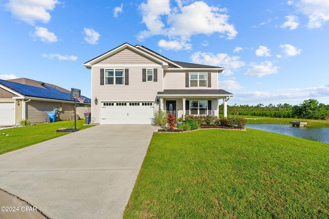 view of front facade featuring a water view, a front lawn, covered porch, and a garage