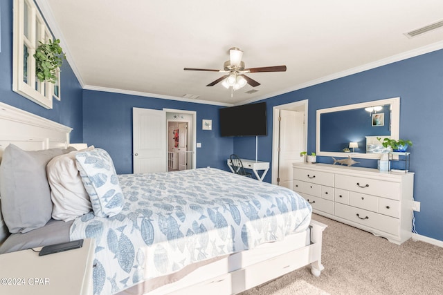 bedroom featuring ceiling fan, light carpet, and crown molding