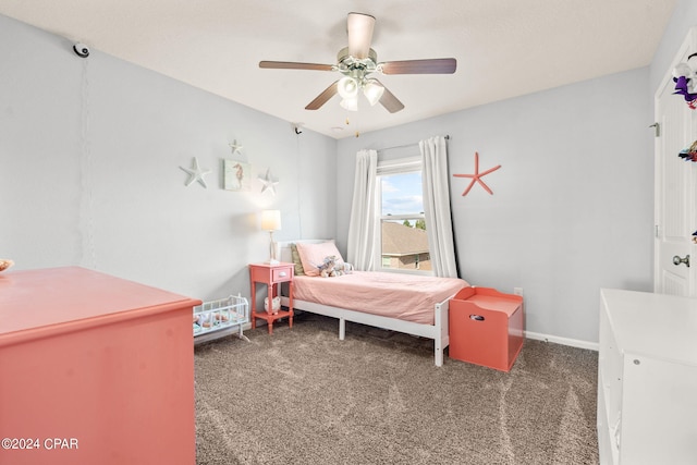 bedroom with dark carpet and ceiling fan