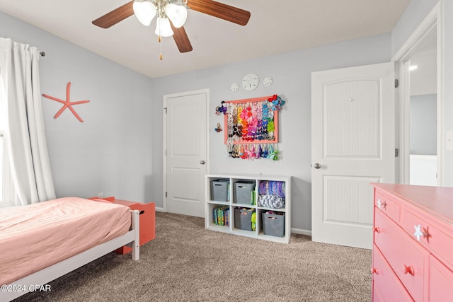 bedroom featuring light carpet and ceiling fan