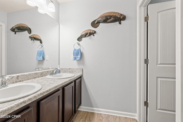 bathroom featuring vanity and hardwood / wood-style flooring