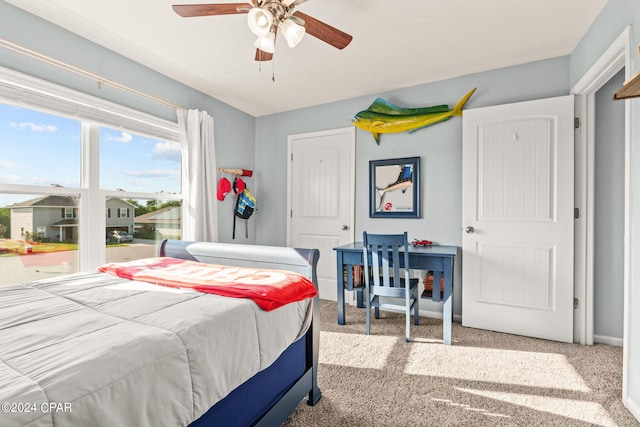 carpeted bedroom featuring ceiling fan