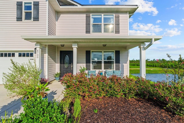 view of front of home featuring a garage and covered porch