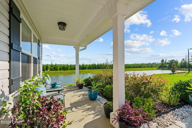 view of patio / terrace featuring a water view