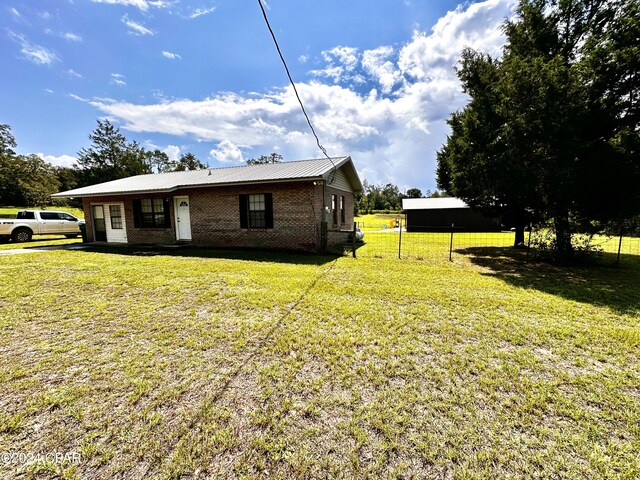 exterior space featuring a front yard