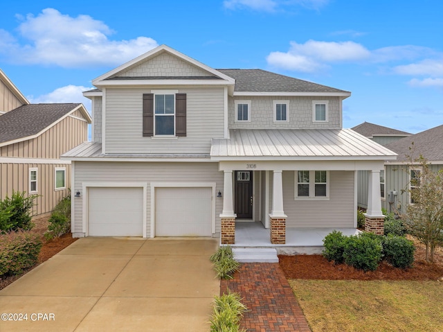 view of front of home with a garage and covered porch