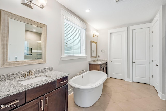 bathroom with vanity, separate shower and tub, and tile patterned floors