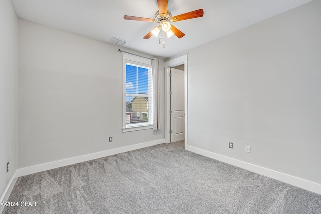 unfurnished room featuring carpet floors and ceiling fan