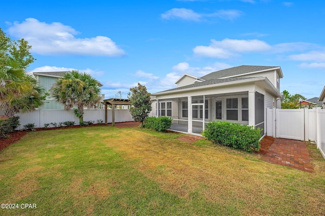 view of yard with a pergola and a sunroom