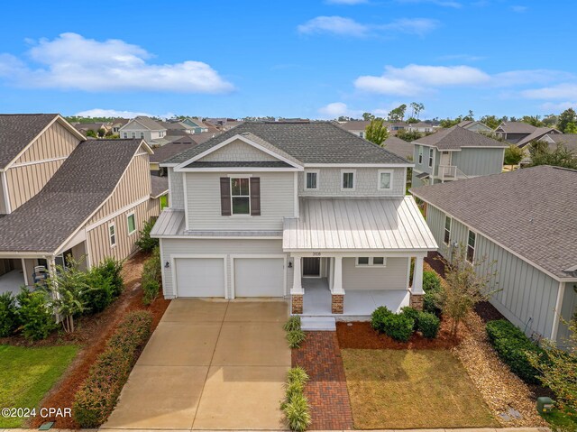 view of front of property with a garage and covered porch