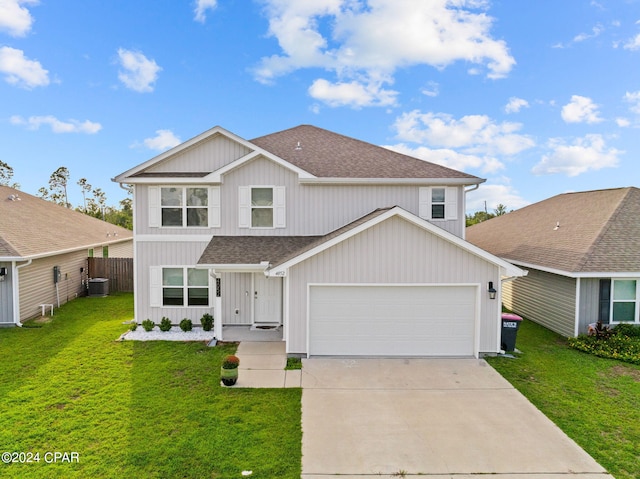 view of front facade with cooling unit, a garage, and a front lawn