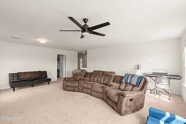 living room with ceiling fan and light colored carpet