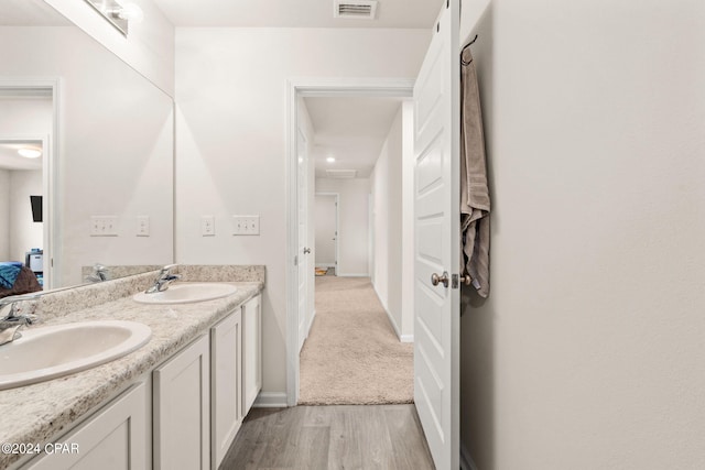 bathroom featuring hardwood / wood-style floors and vanity