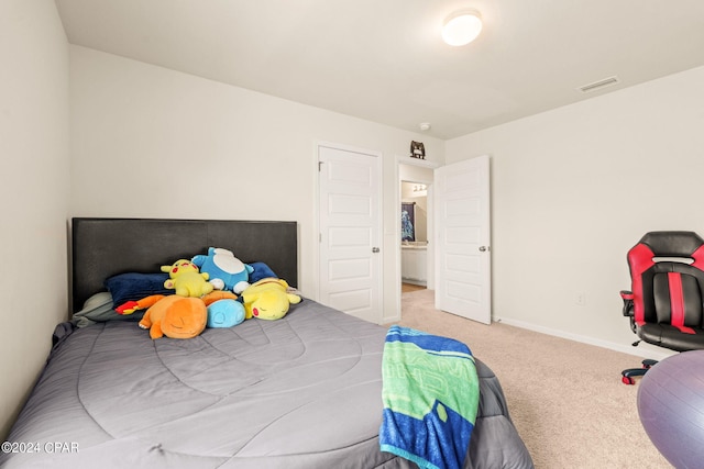 bedroom featuring light carpet