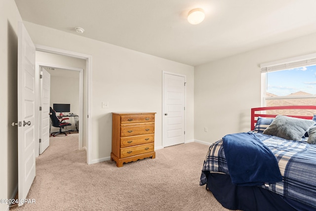 bedroom with light colored carpet