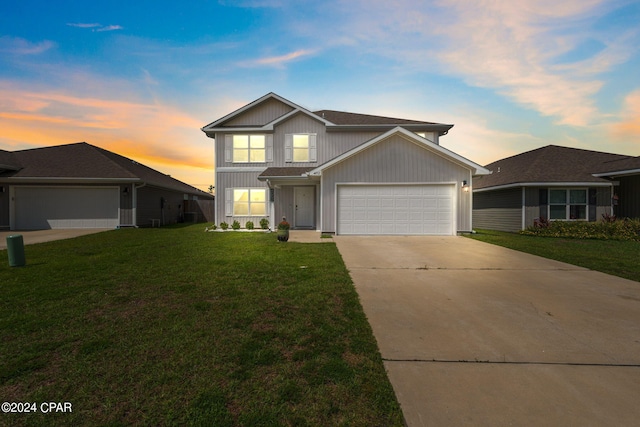 view of front of house with a lawn and a garage