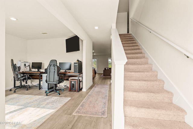 office area with light hardwood / wood-style floors