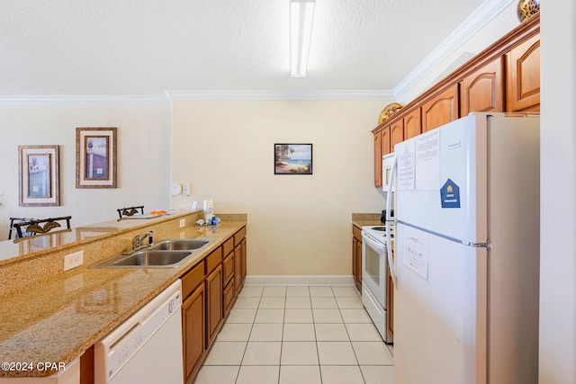 kitchen with a textured ceiling, crown molding, sink, and white appliances