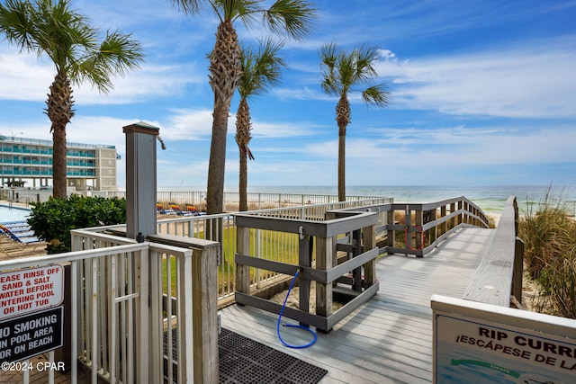 wooden terrace featuring a water view