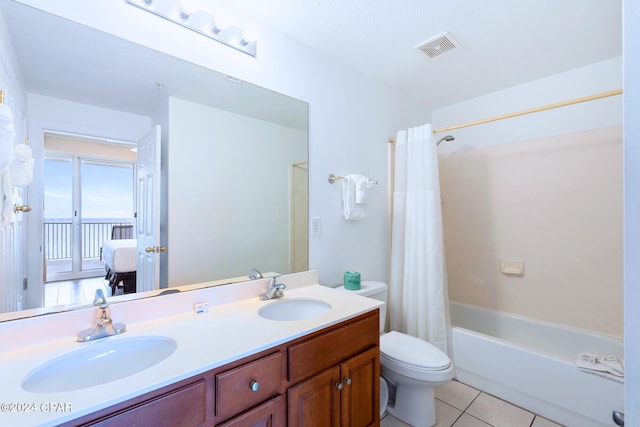 full bathroom with shower / bathtub combination with curtain, tile patterned flooring, vanity, and toilet