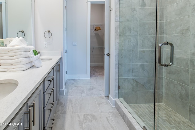 bathroom featuring walk in shower and vanity