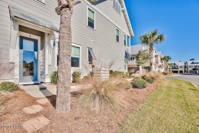 view of home's exterior with a lawn