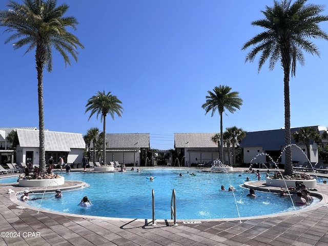 community pool featuring a patio area