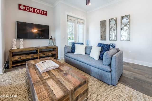 living room with crown molding and hardwood / wood-style floors