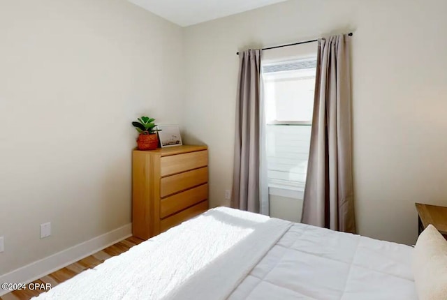 bedroom featuring hardwood / wood-style floors