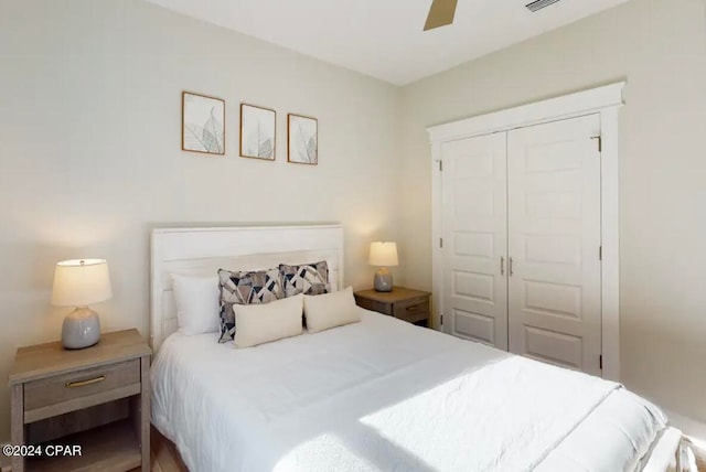 bedroom featuring ceiling fan and a closet