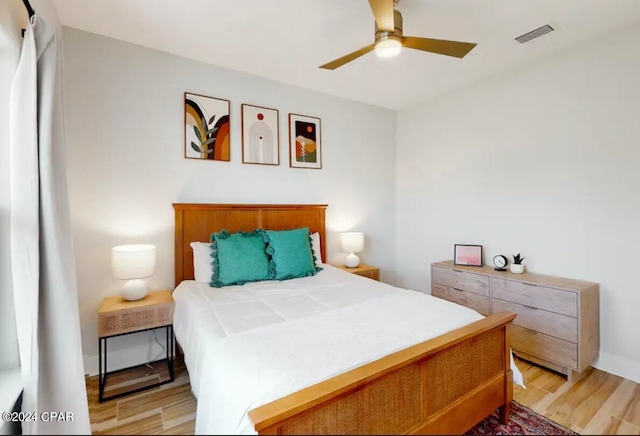 bedroom featuring ceiling fan and light hardwood / wood-style flooring