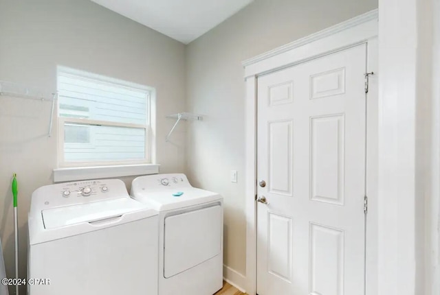 clothes washing area with washer and dryer