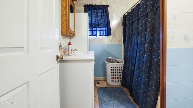 bathroom with walk in shower and vanity