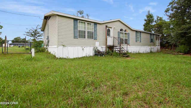 manufactured / mobile home with a front lawn