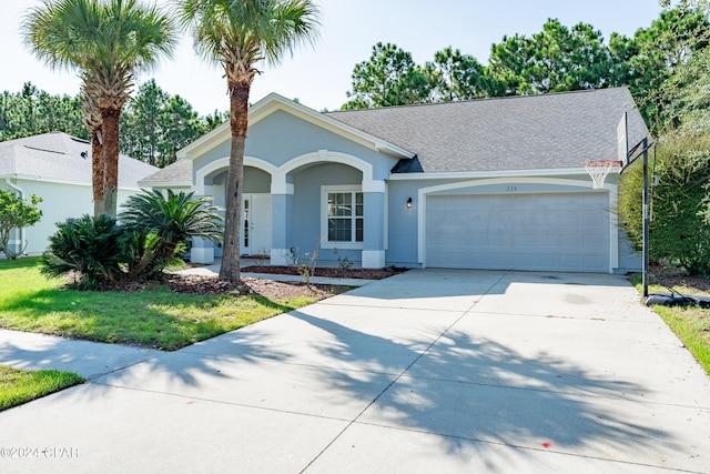 single story home featuring a garage