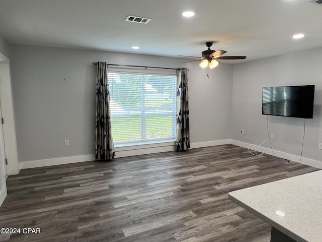 unfurnished living room with baseboards, recessed lighting, dark wood-style floors, a ceiling fan, and visible vents