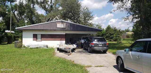 garage with a lawn and central air condition unit