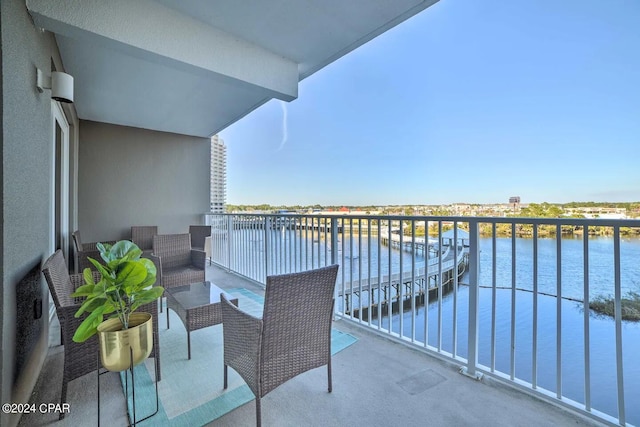 balcony featuring a water view