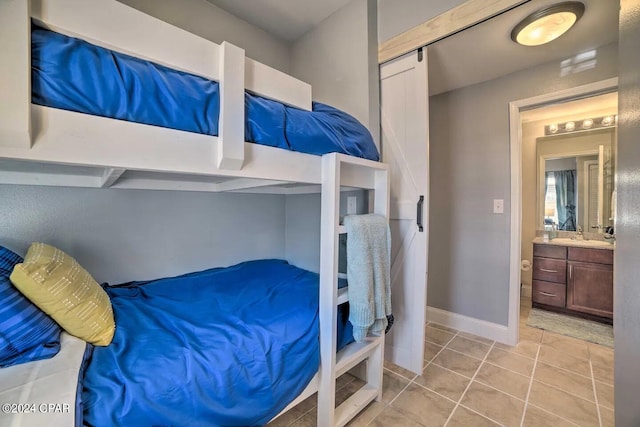 bedroom featuring light tile patterned floors