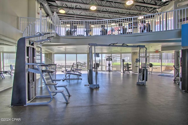 gym with a towering ceiling