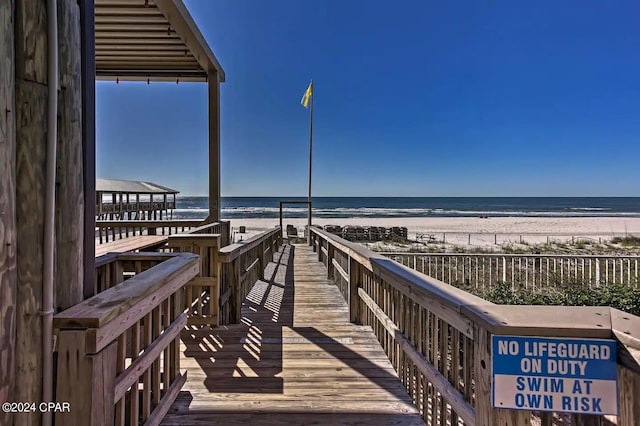 view of home's community featuring a view of the beach and a water view