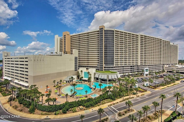 view of property featuring a community pool