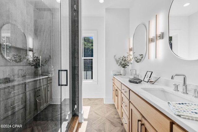 bathroom with vanity and an enclosed shower