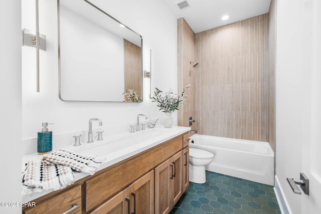 full bathroom featuring tub / shower combination, tile patterned floors, vanity, and toilet