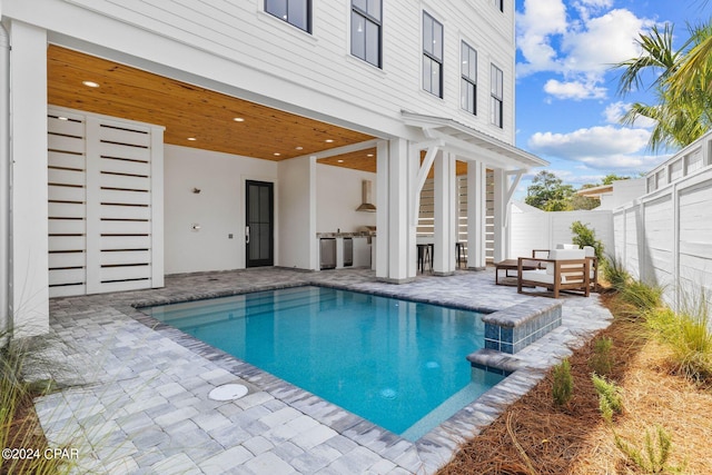 view of swimming pool with a patio